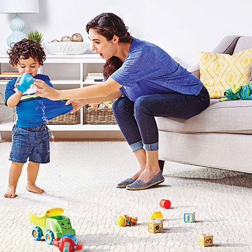 mother and son playing with toys in a living room with white carpet floor from Carpet On Wheels in the Jamesburg, NJ area