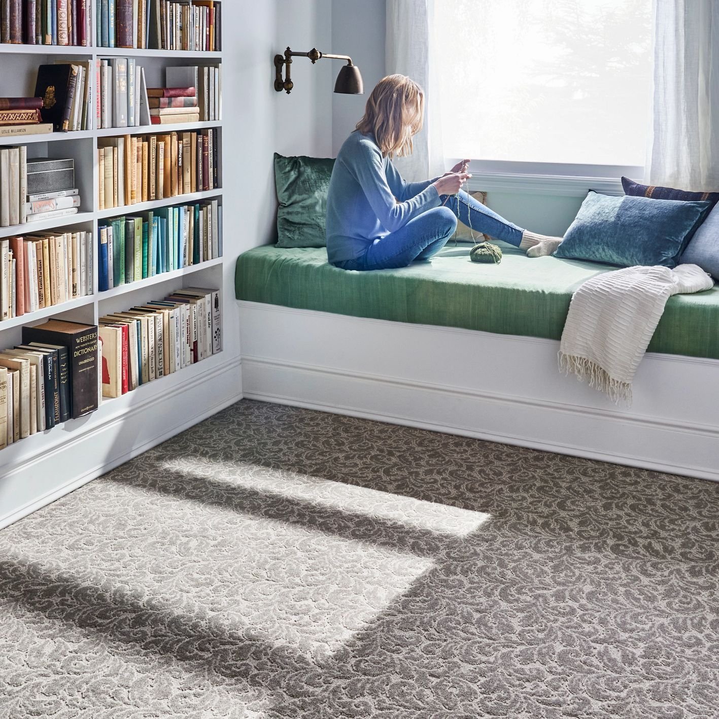 white bedroom furniture and a large window lighting the room and brown carpet from Carpet On Wheels in the Jamesburg, NJ area